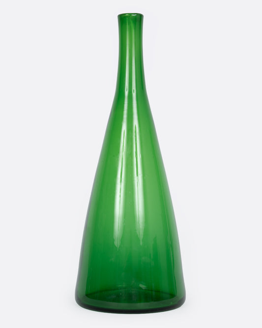 A tall tapered green glass vase, shown from the front.
