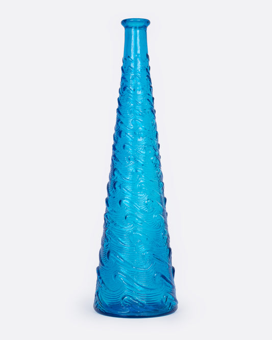 A tall tapered cerulean glass vase with a wavy textured exterior, shown from the front.