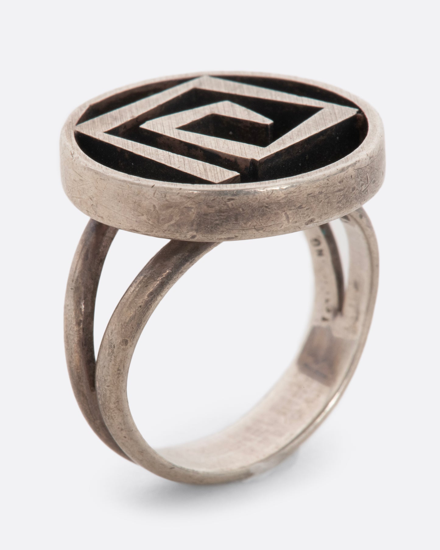 Circular sterling ring with a 3D geometric spiral. View standing up.