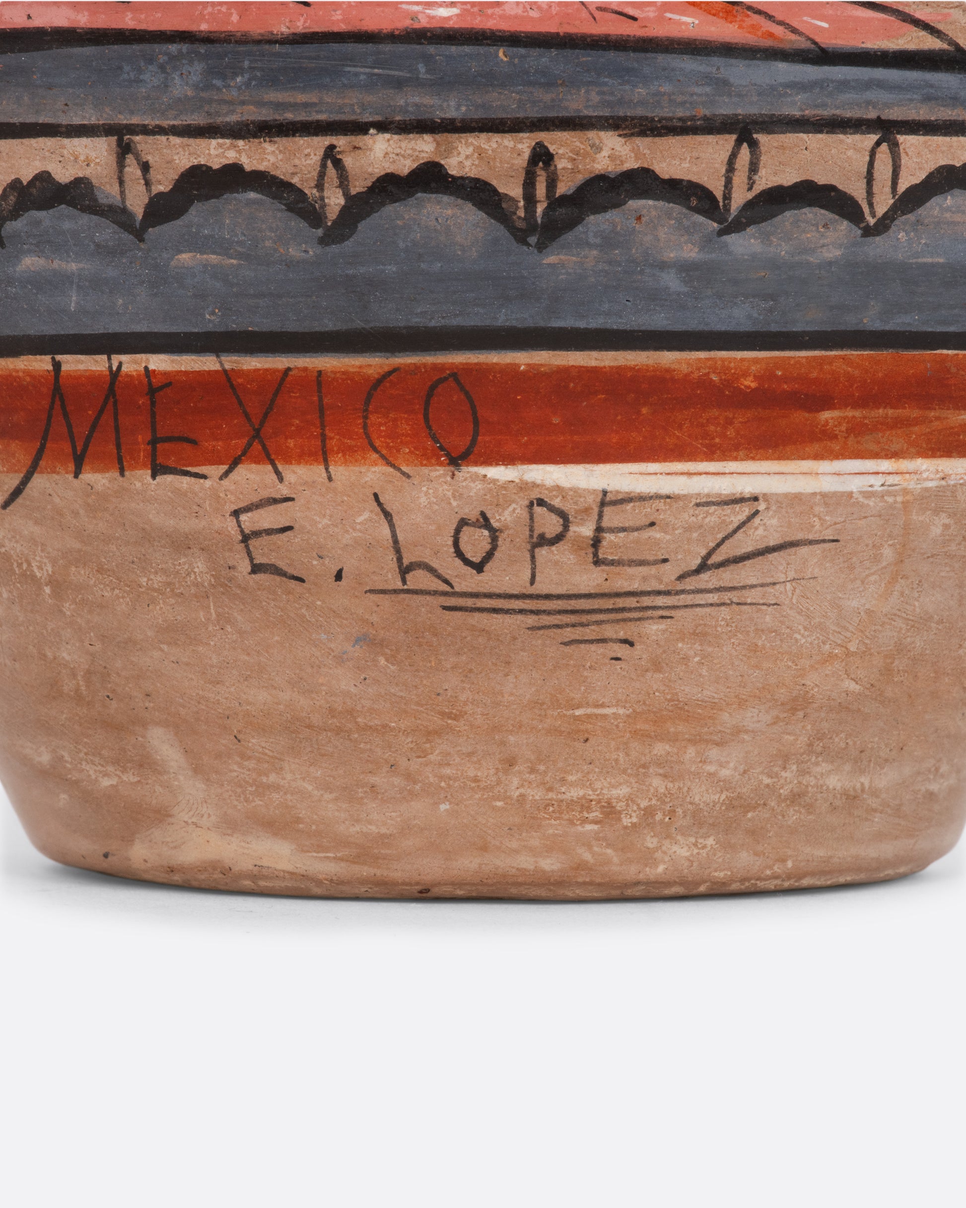 Mexican cceramic tonala vase with painted flowers and owl. View of the signature.