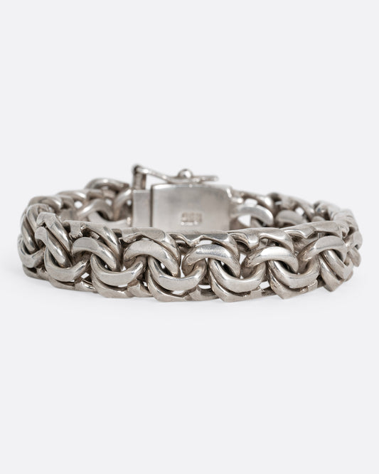 A silver double link bracelet with a reinforced invisible clasp shown from the front.