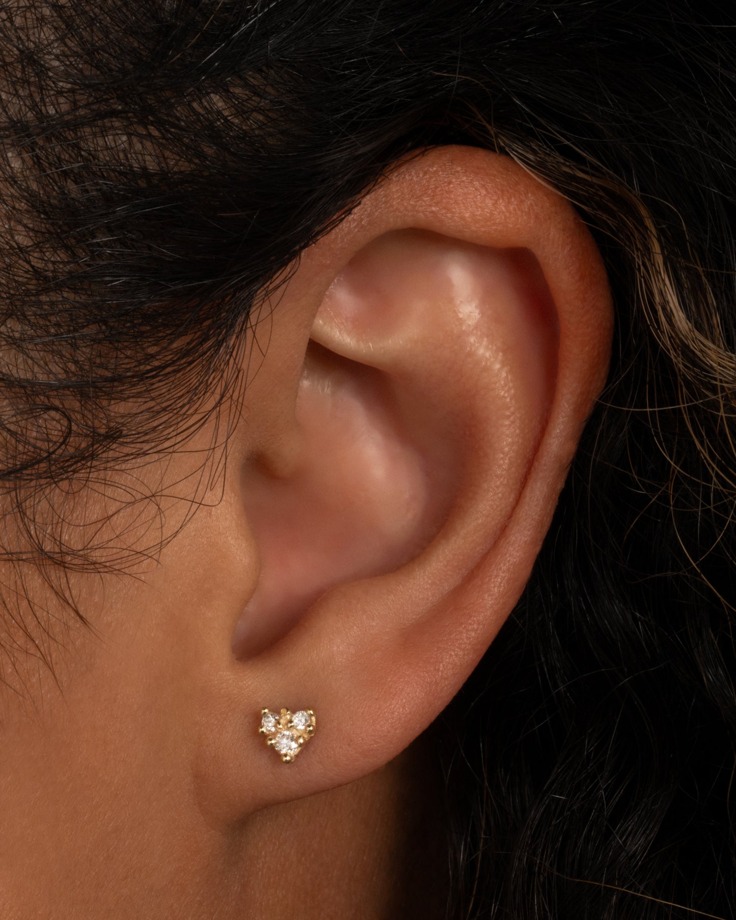 Not your average diamond earring; this piece looks great in a second or third piercing.