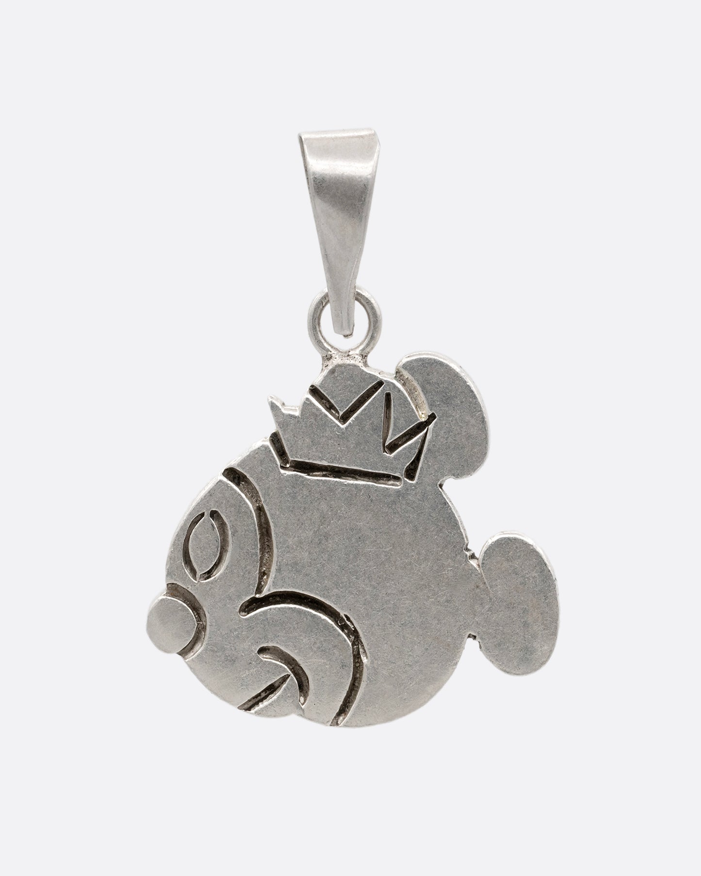 A silver hand carved Mickey Mouse profile charm with a crown. Shown from the front.