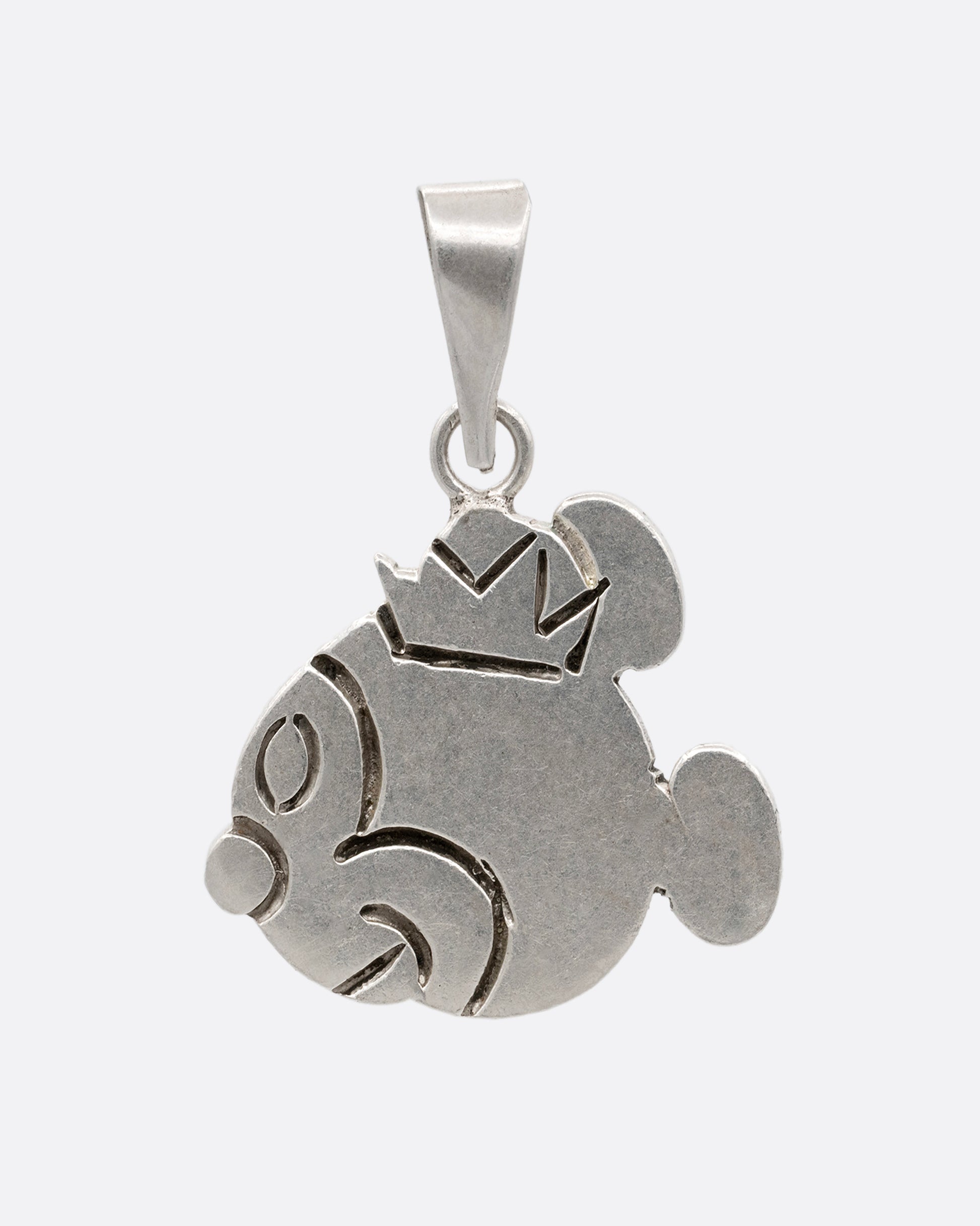 A silver hand carved Mickey Mouse profile charm with a crown. Shown from the front.