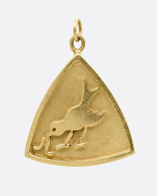 A yellow gold triangular charm with a bird getting worm on the front. Shown from the front.