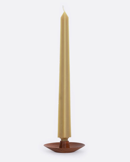 Mahogany wood taper candle holder, side view with a candle