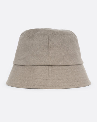 A green bucket hat with a short brim and is made from cotton/ linen blend, shown from the back.