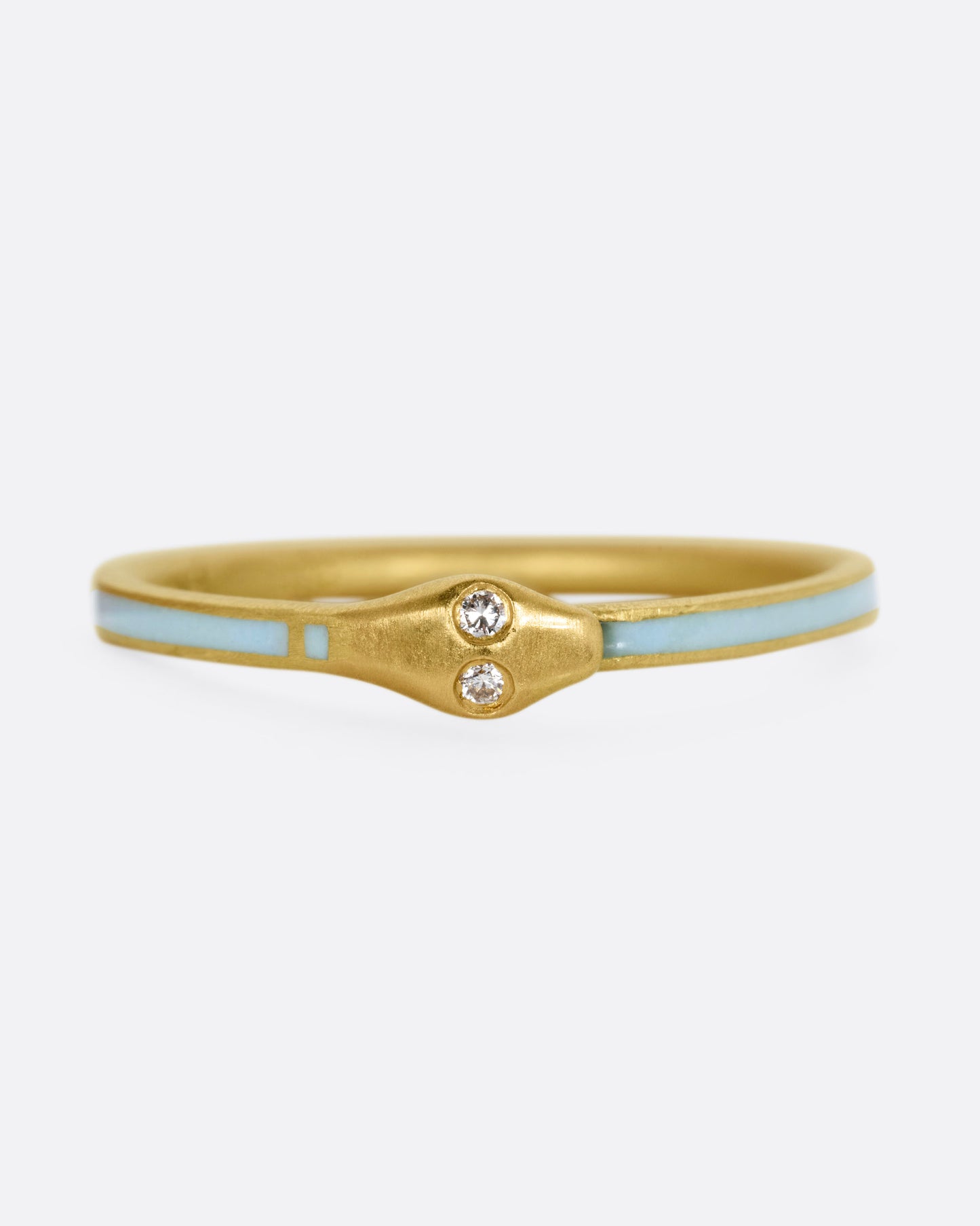 A yellow gold ouroboros ring with diamond eyes and light blue enamel, shown from the front.