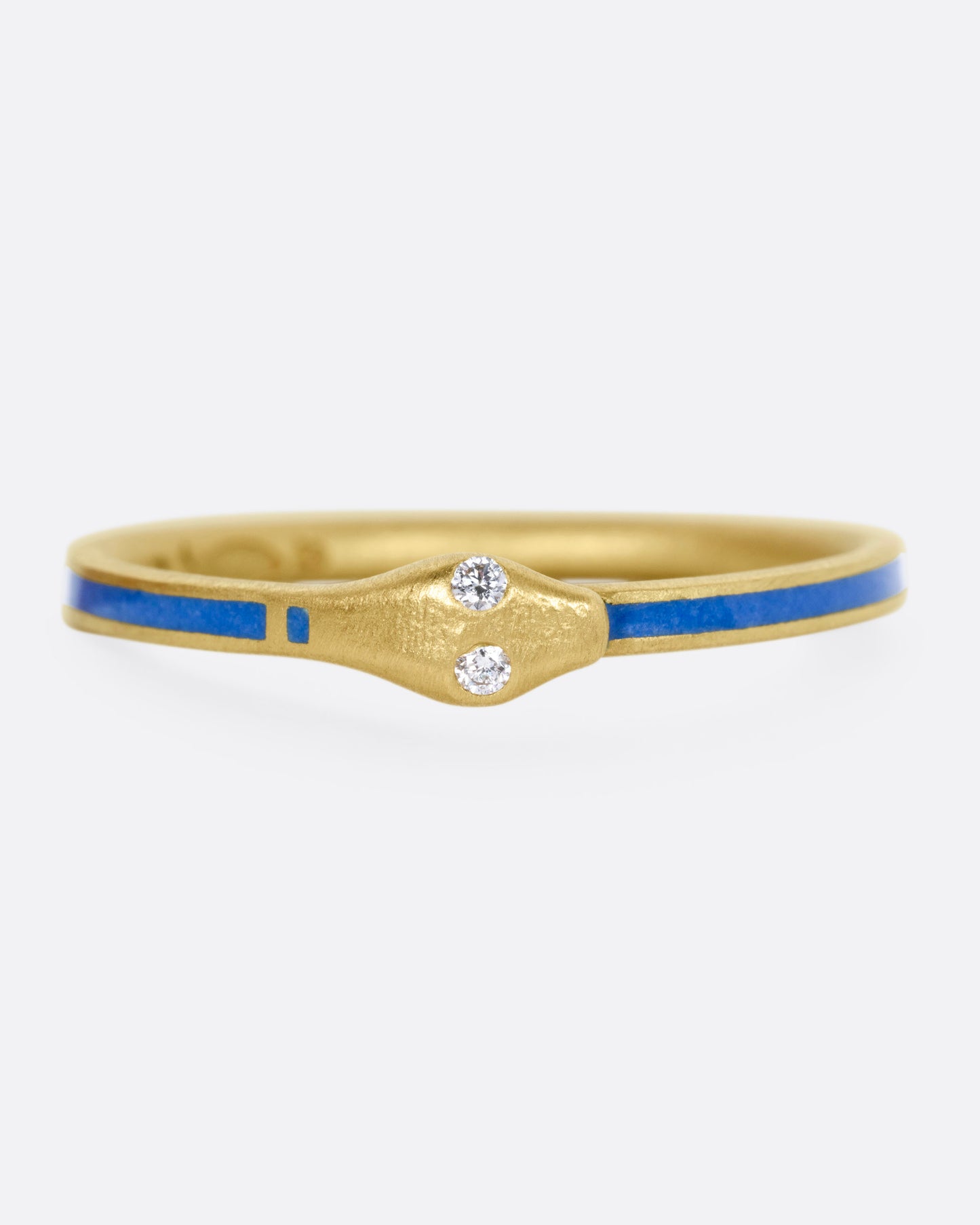 A yellow gold ouroboros ring with diamond eyes and blue enamel, shown from the front.
