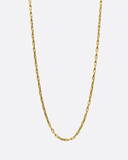 A yellow gold box chain with elongated links, shown from the front.
