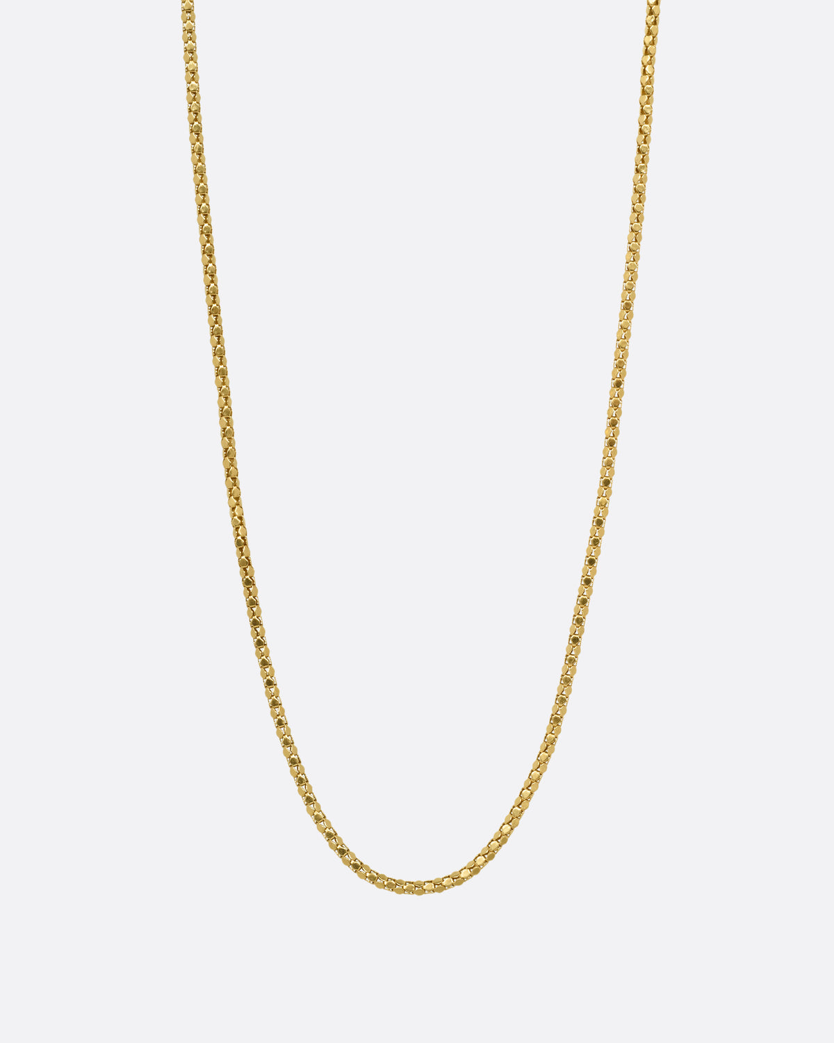 A yellow gold tube chain necklace, shown from the front.