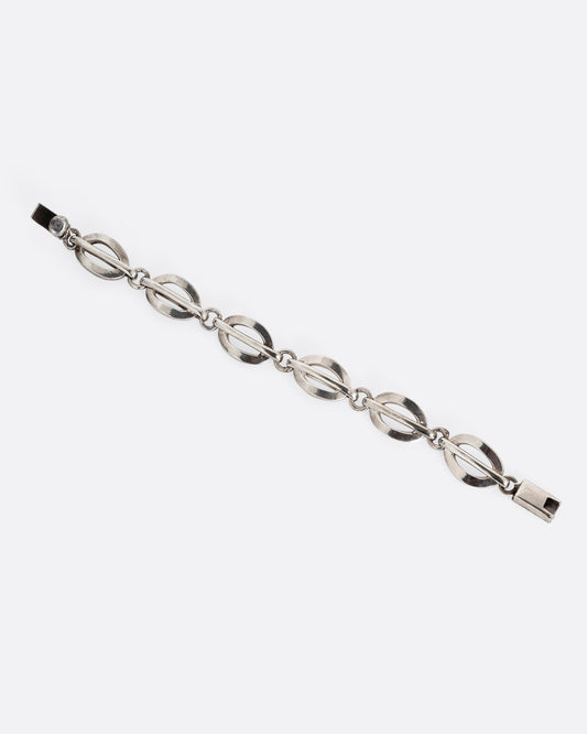 A silver split oval link bracelet. Shown open lying flat.