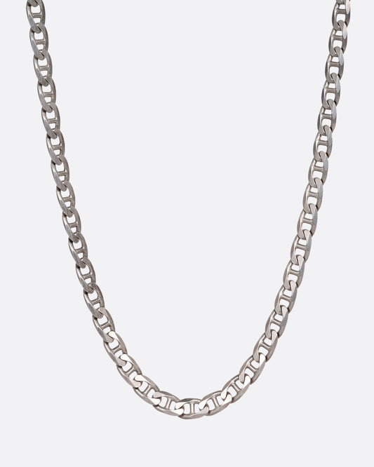 A silver anchor link chain necklace, shown from the front.