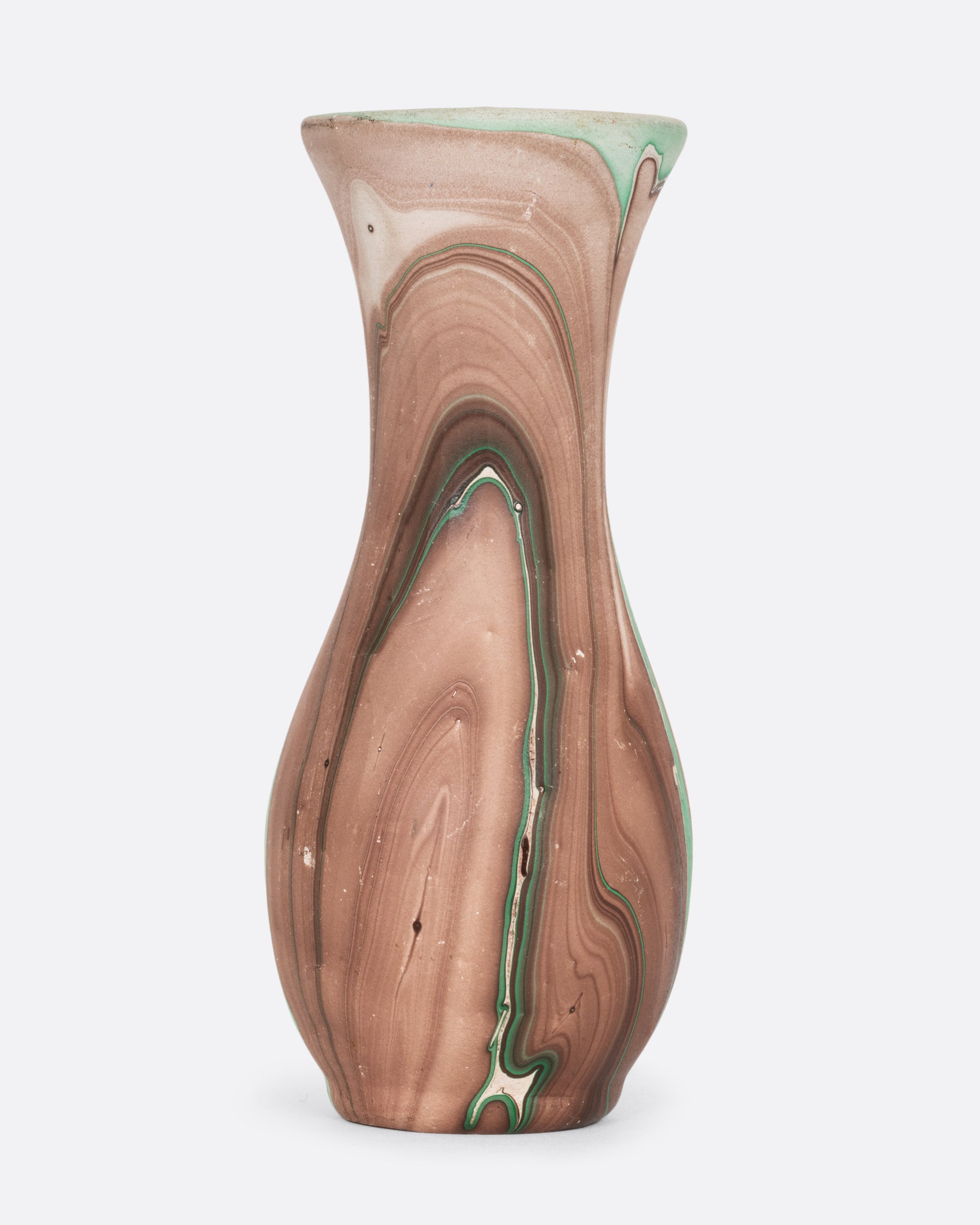 A green and brown swirled vase. Shown from the side.