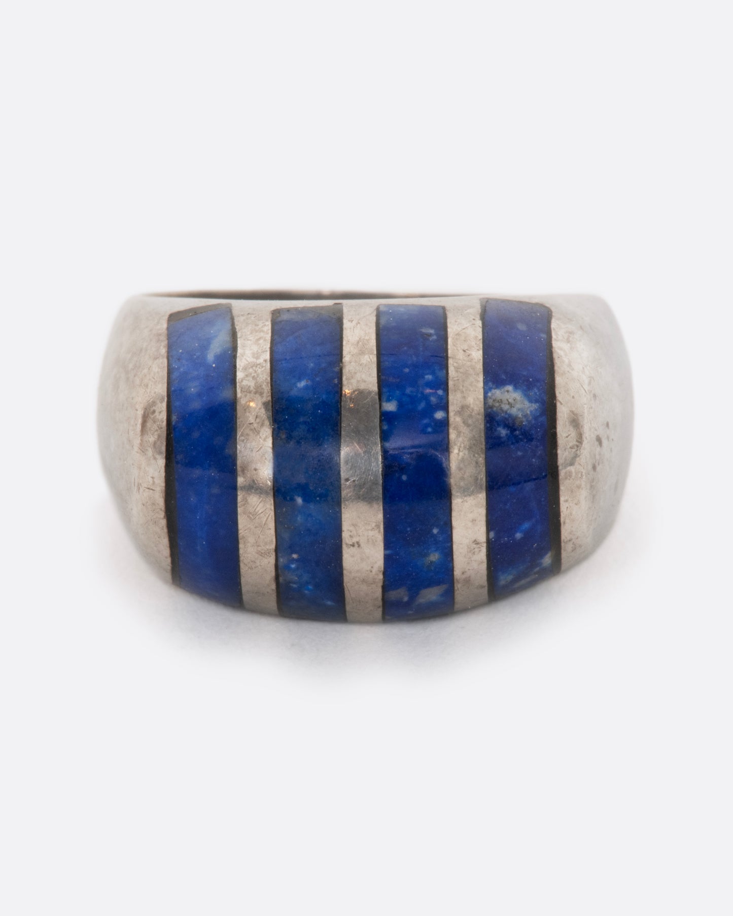 A sterling silver ring with four lapis sections. View from the front.