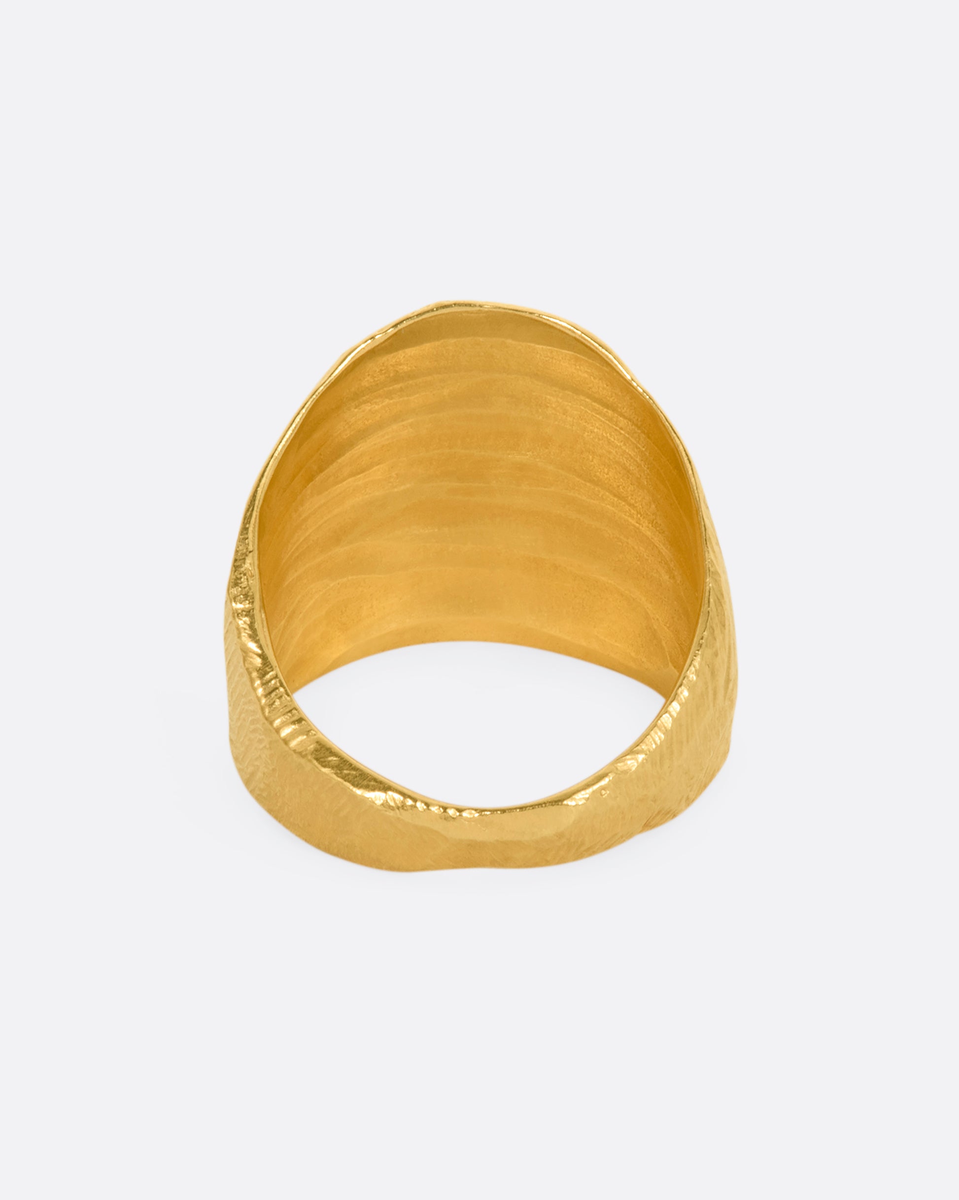 Textured yellow gold wide band ring. View from the back.