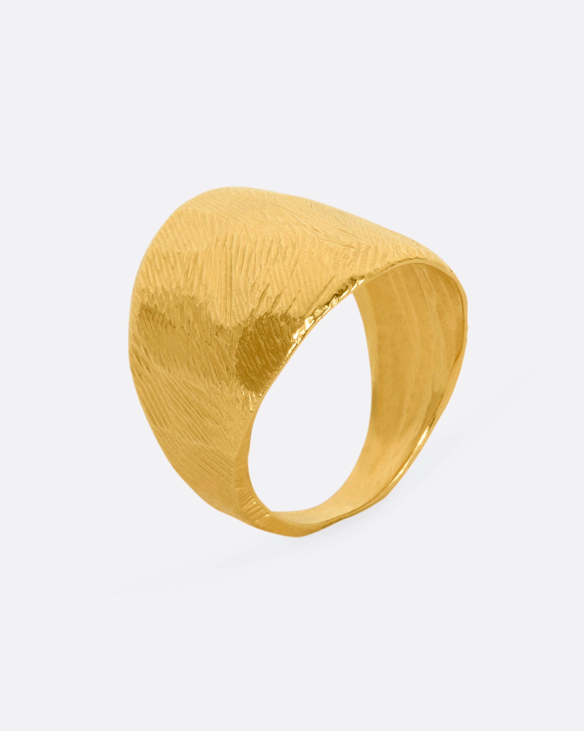 Textured yellow gold wide band ring. View standing up.