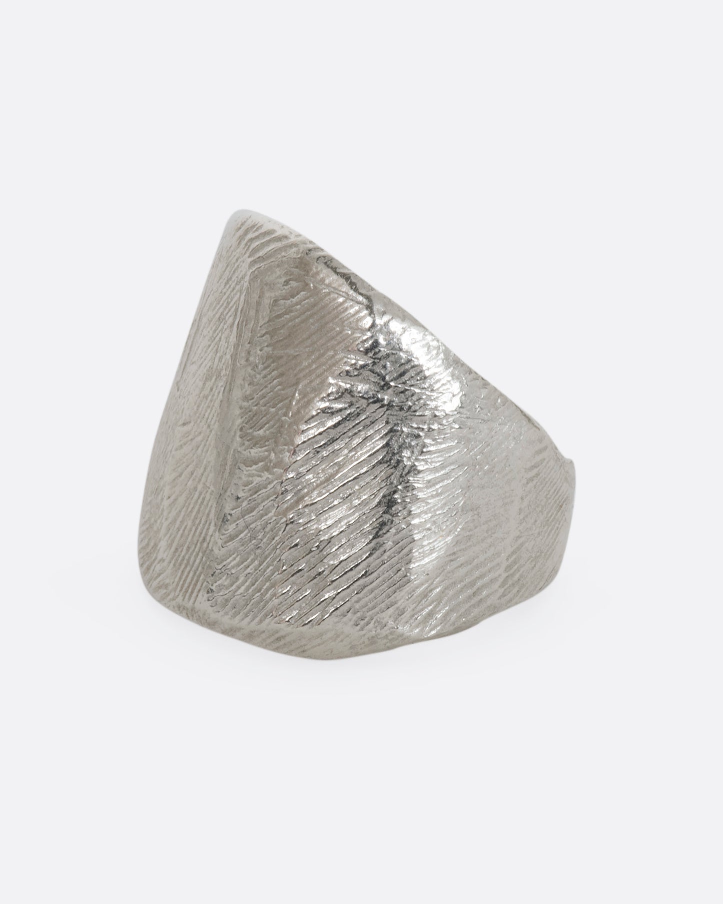 Textured sterling silver wide band ring. View from the side.