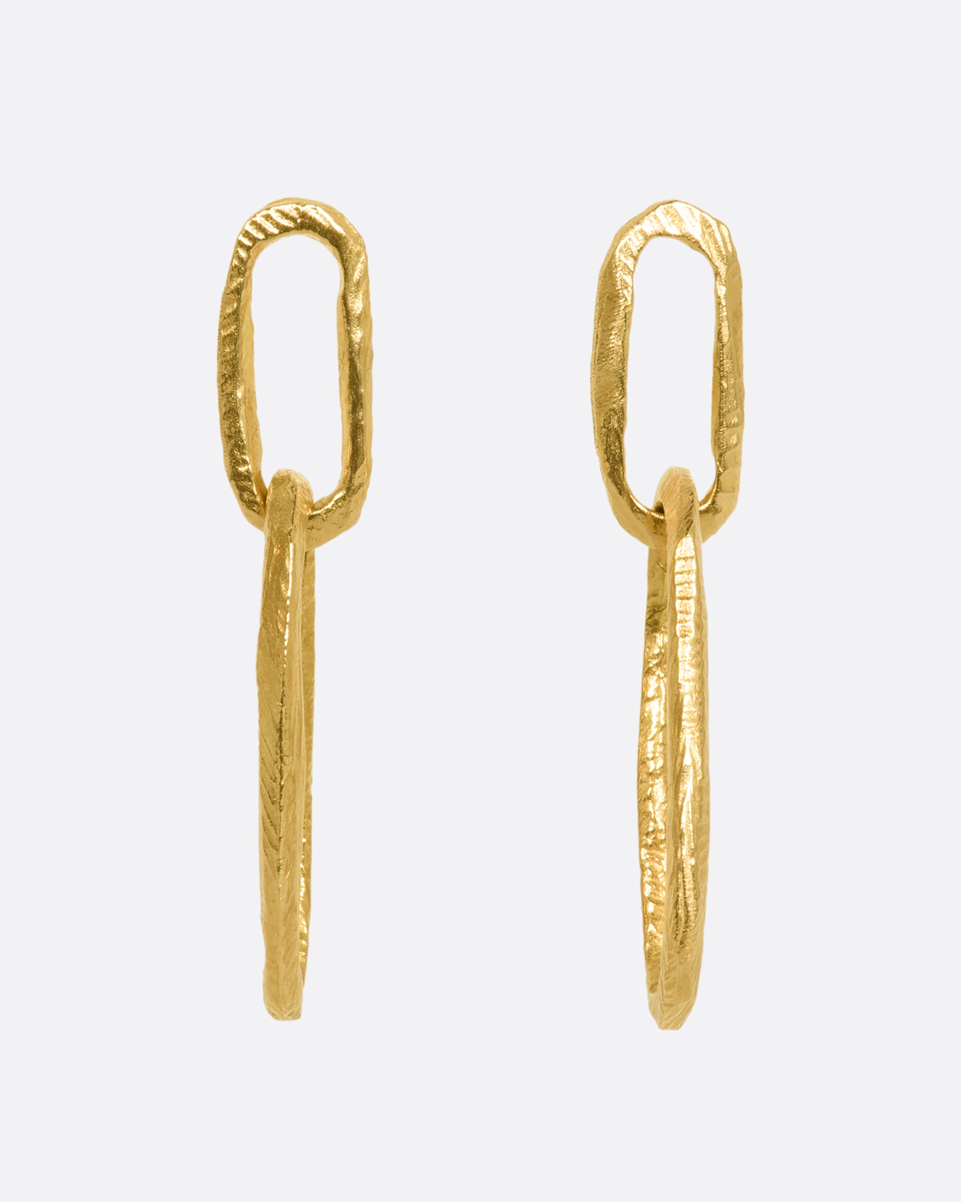 Yellow gold textured oval link earrings with stud backings. View from the front.