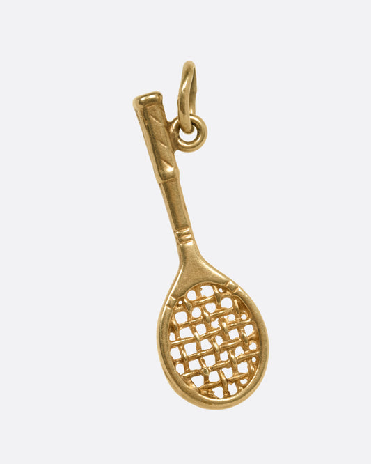 A gold tennis racket pendant charm with a woven string design, shown from the front.