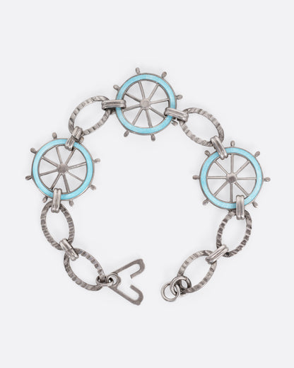 Vintage silver blue enamel ship wheel bracelet, shown with the clasp open