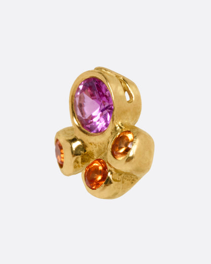 A yellow gold stud earring with a pink and orange sapphire cluster, shown from the side.
