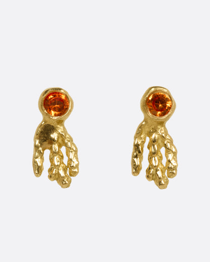 Kimberlin Brown Comet stud earrings in 18k yellow gold, an orange sapphire with a textured gold tail