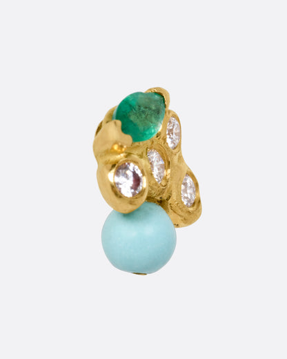 A yellow gold stud earring with diamonds, an emerald, and a turquoise. Shown from the side.