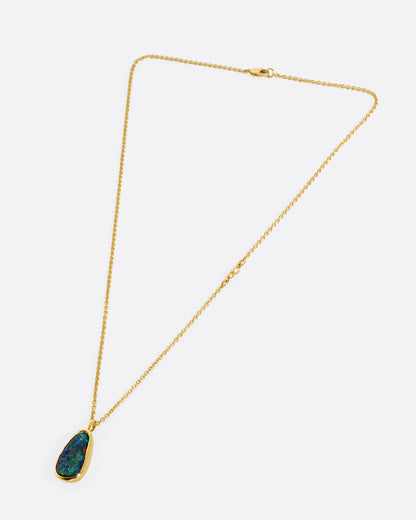A yellow gold cable chain with an Australian opal and diamond accents, shown from the front.