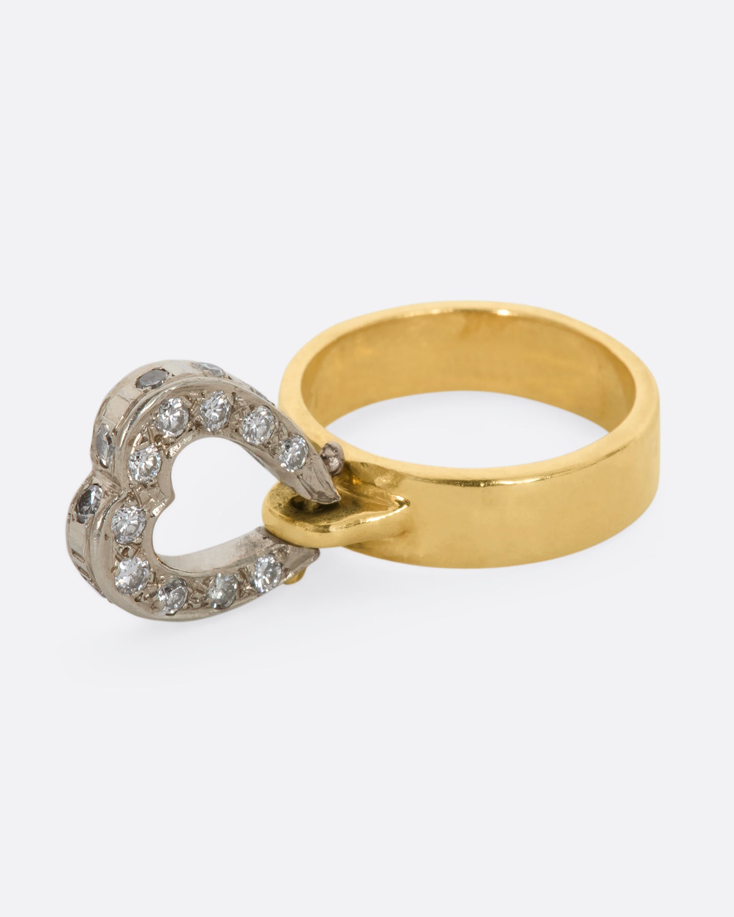 Yellow gold diamond hinged heart ring. View with the diamond swung out.