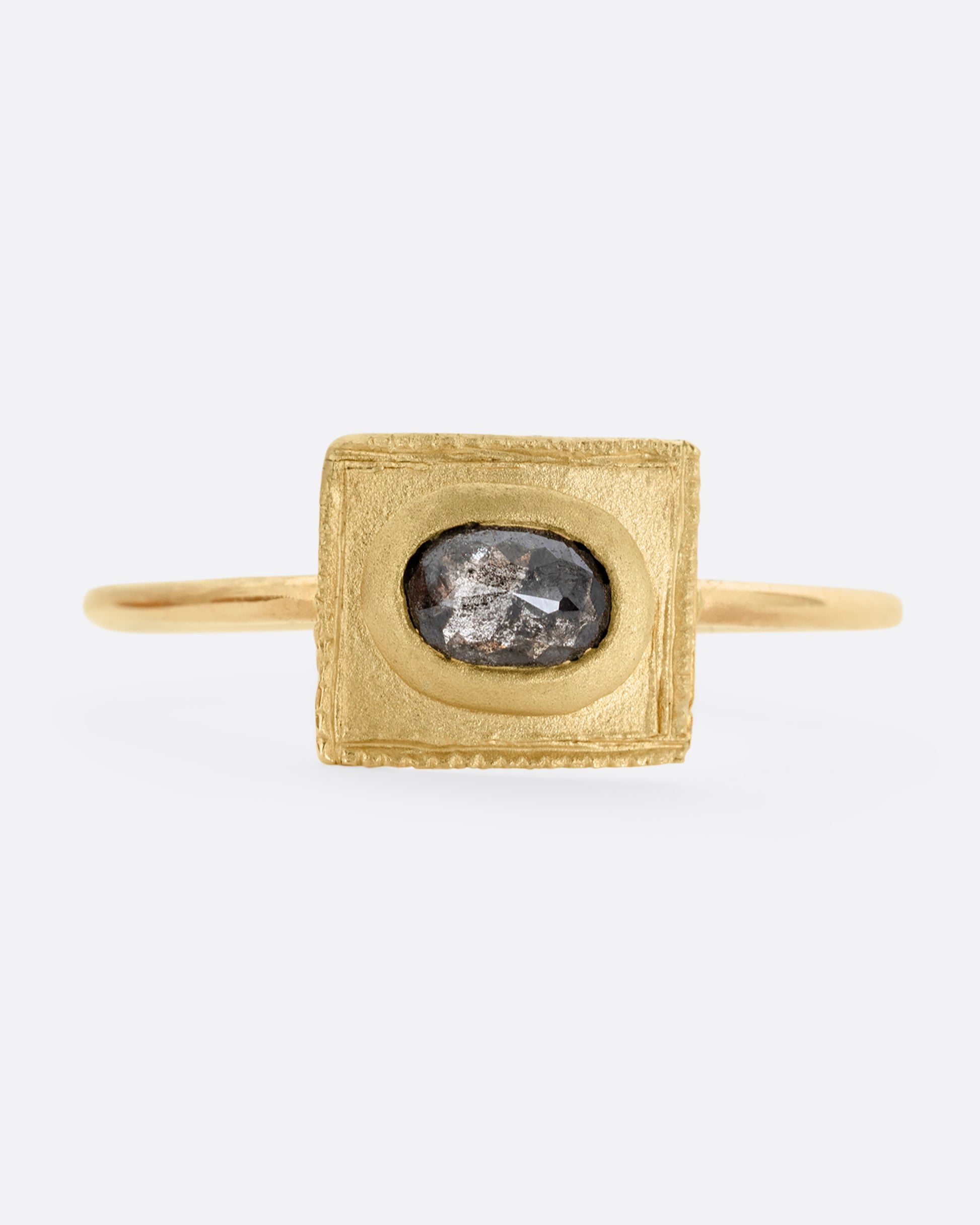 A yellow gold ring with a rectangular face and a rose cut diamond. Shown from the front.