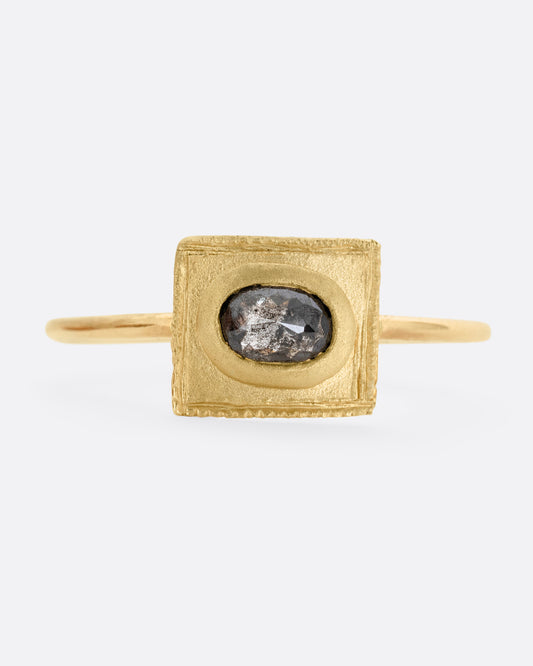 A yellow gold ring with a rectangular face and a rose cut diamond. Shown from the front.
