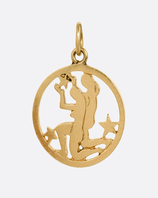 An open silhouetted pendant with the Gemini Twins at the center. Shown from the front.