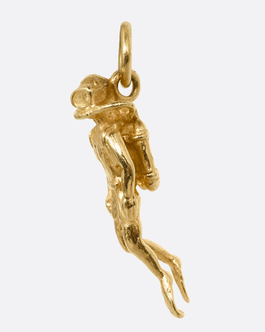 A yellow gold scuba diver pendant shown from the front.