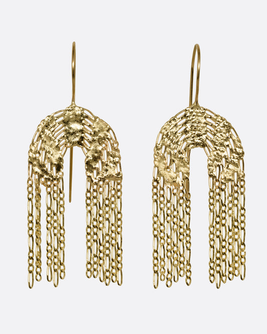 A pair of yellow gold dangle earrings with soldered rainbow shaped tops and Figaro chain fringe bottoms. Shown from the front.
