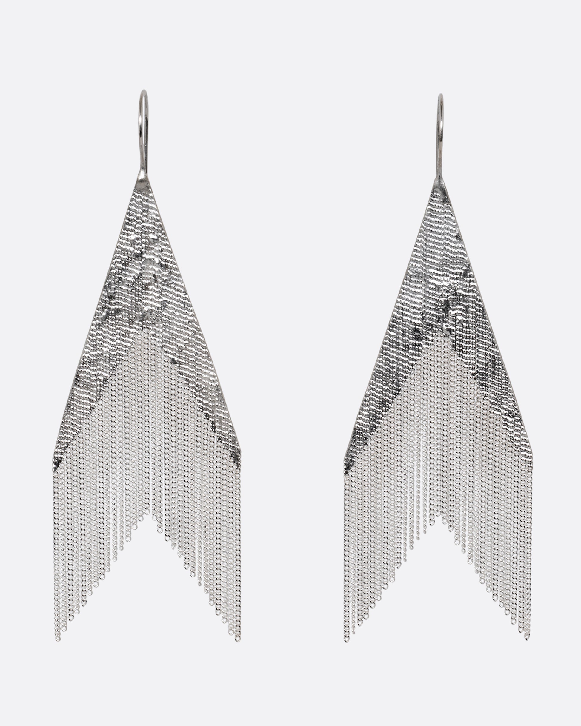 A pair of arrow shaped silver dangle earrings with cable chain fringe. Shown from the front.