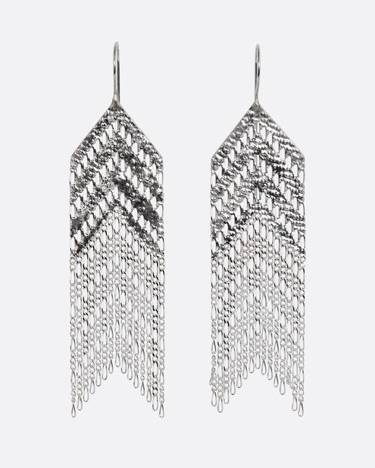 A pair of arrow shaped silver dangle earrings with Figaro chain fringe. Shown from the front.