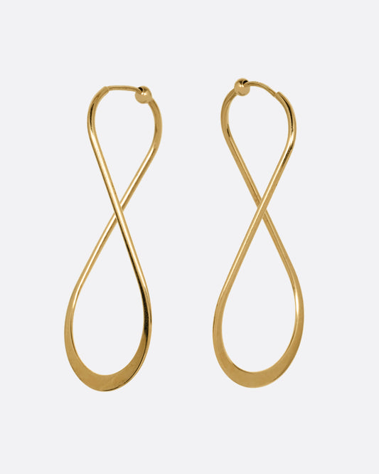 A pair of yellow gold hoop earrings with a subtle twist at the top. Shown from the front.