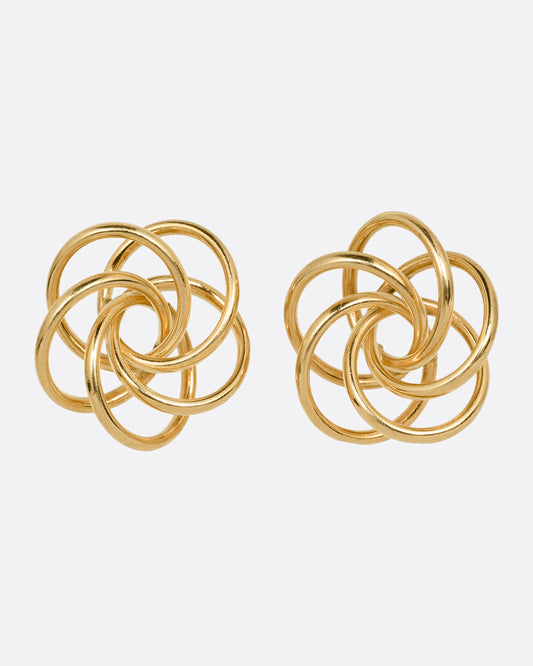 A pair of yellow gold earrings with knotted circles. Shown from the front.