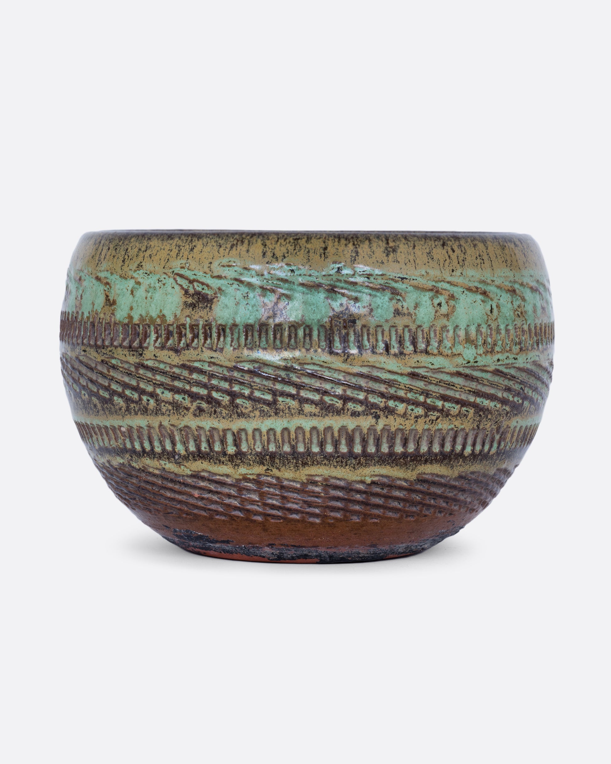 A round green textured pot shown from the front.