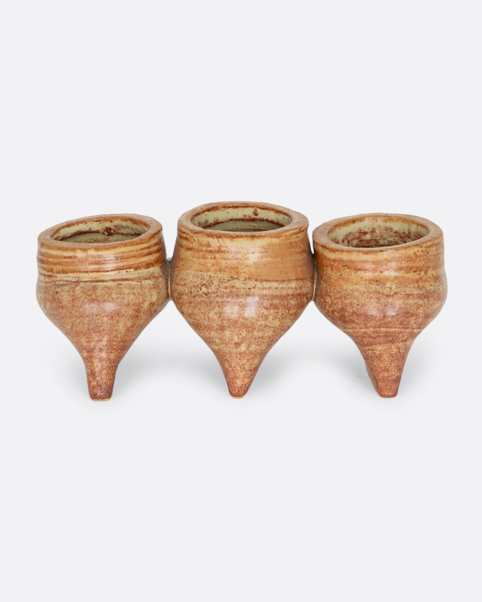 Three connected planters with pinched bottoms, drainage holes, and feet. Shown from the side.