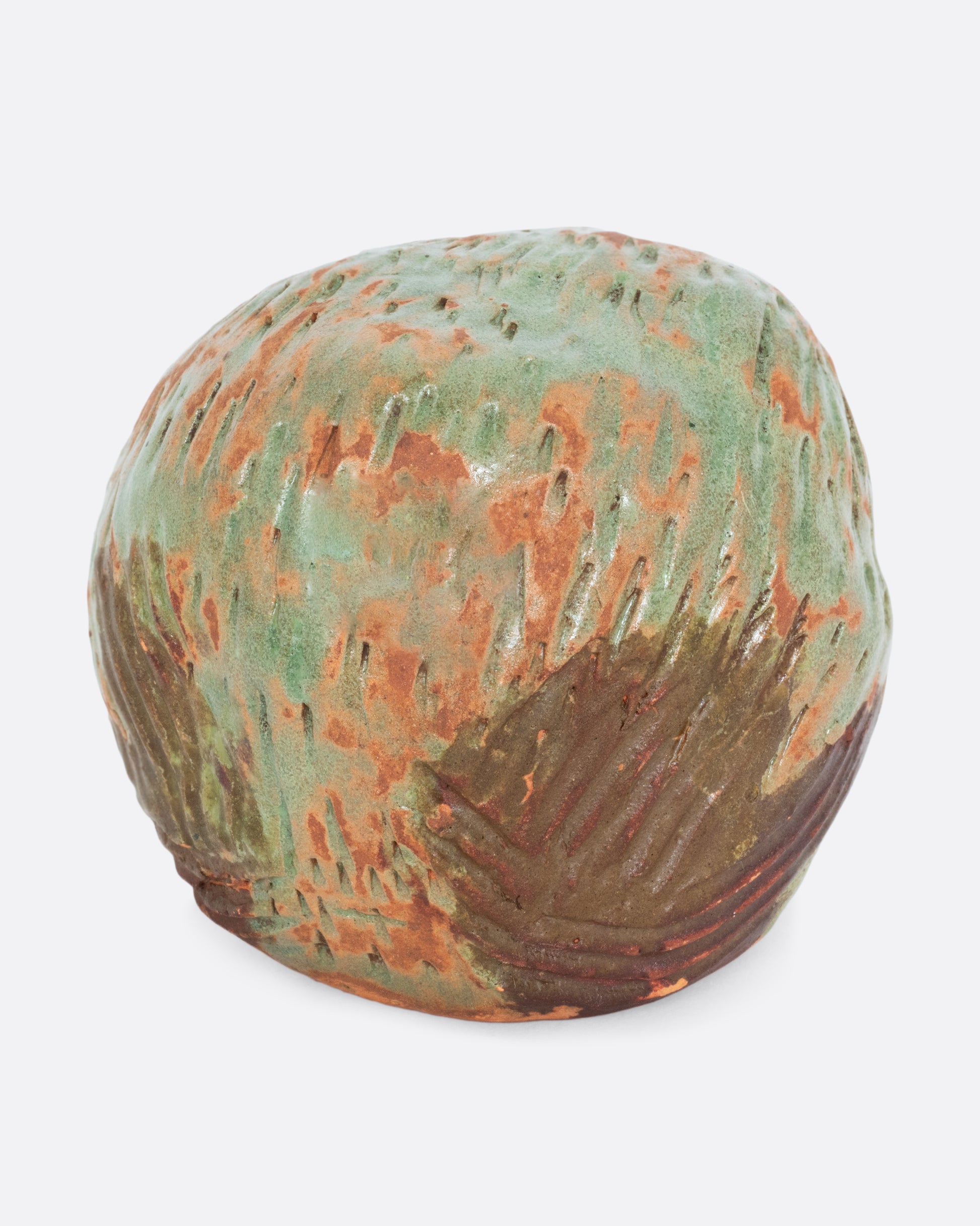 A  ceramic owl with a vibrant hand painted glaze. Shown from the back.