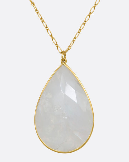 Lola Brooks necklace in yellow gold, a large faceted moonstone teardrop in a gold bezel on a link chain