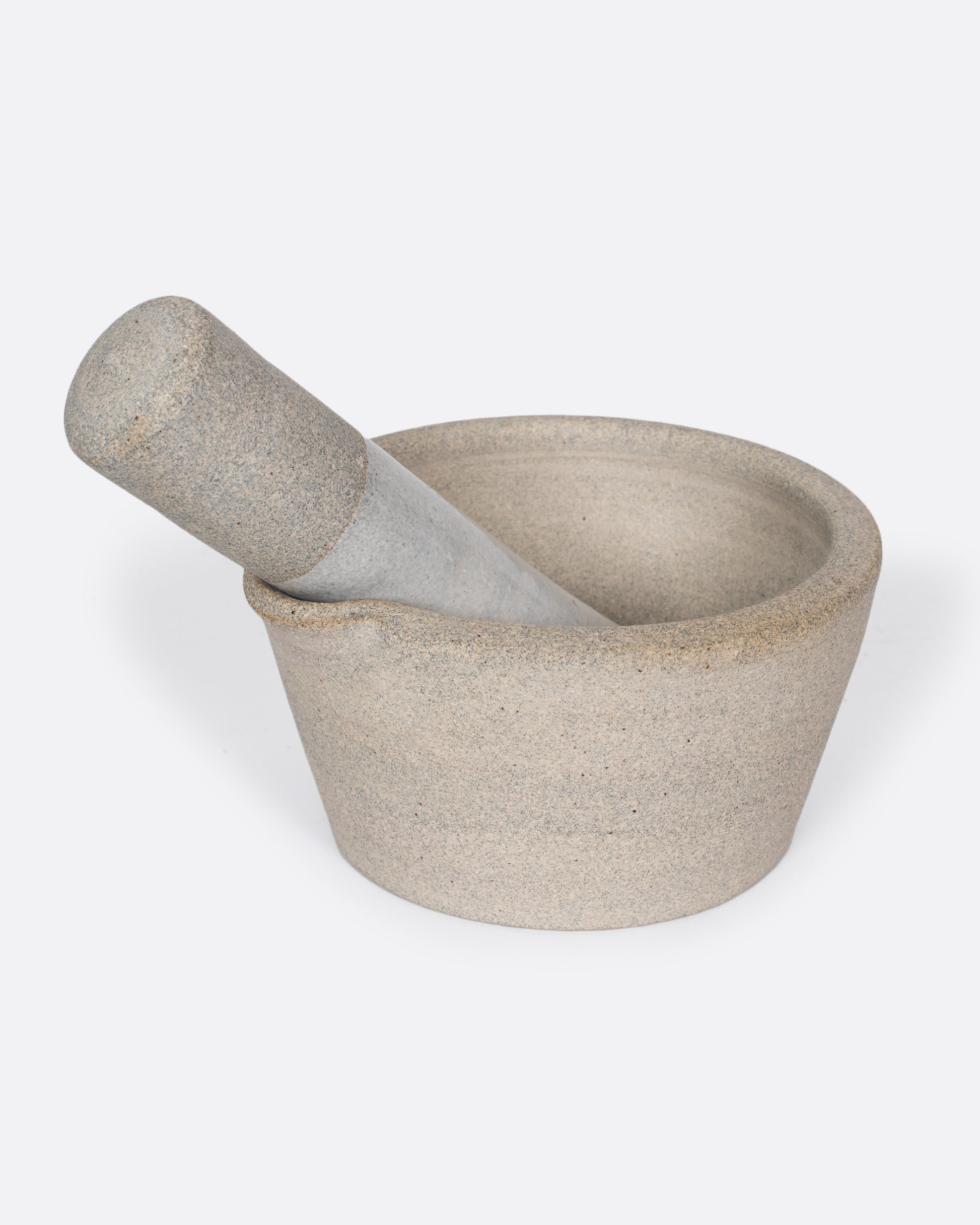 Broad-rimmed and heavy, this mortar and pestle is both beautiful and highly functional, easy to clean and stain-resistant.
