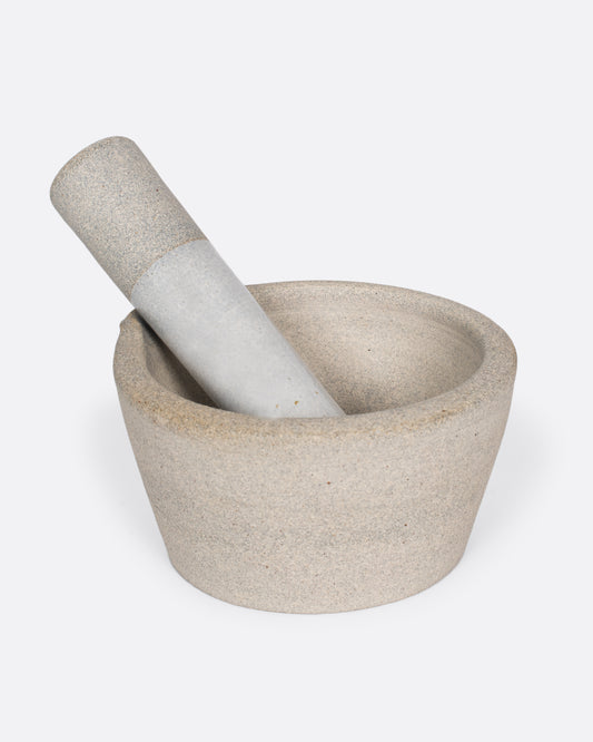 Broad-rimmed and heavy, this mortar and pestle is both beautiful and highly functional, easy to clean and stain-resistant.