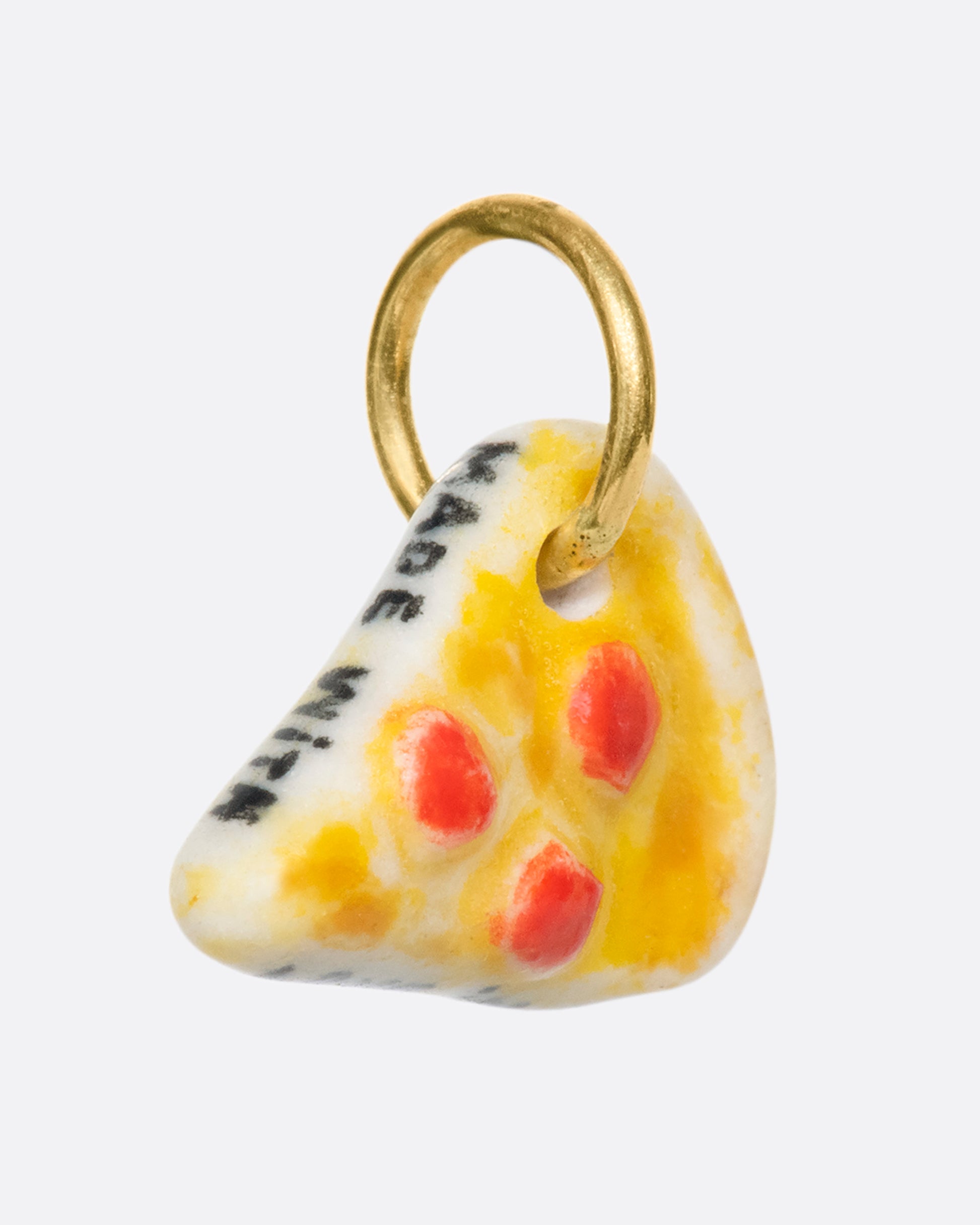 A handmade and painted porcelain pepperoni pizza slice charm with a 14K gold bail.