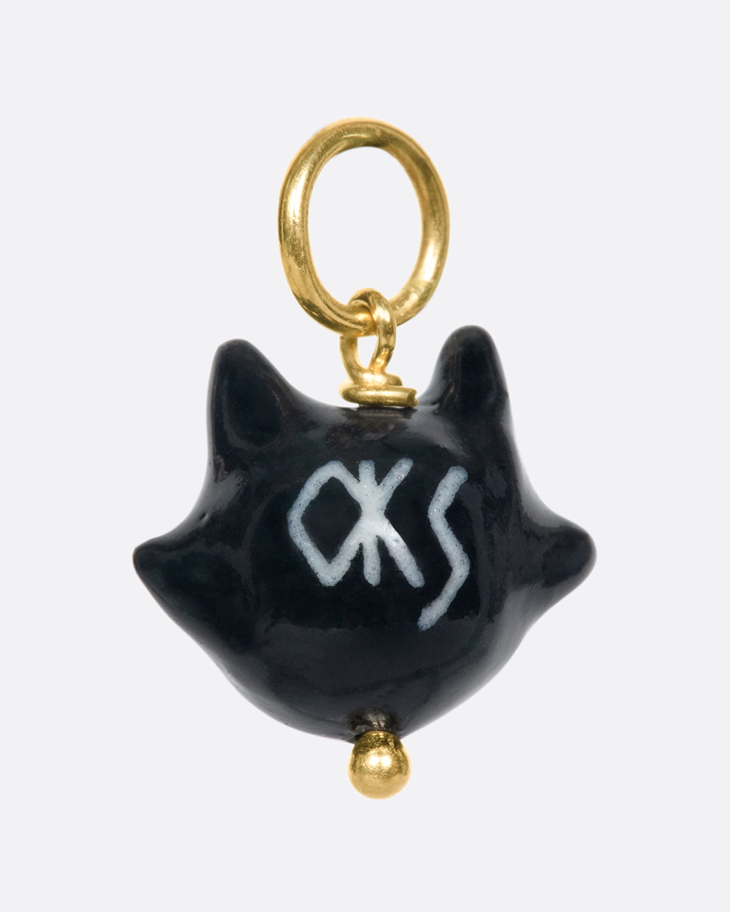 A handmade and painted porcelain Felix the Cat charm with a 14k gold bail