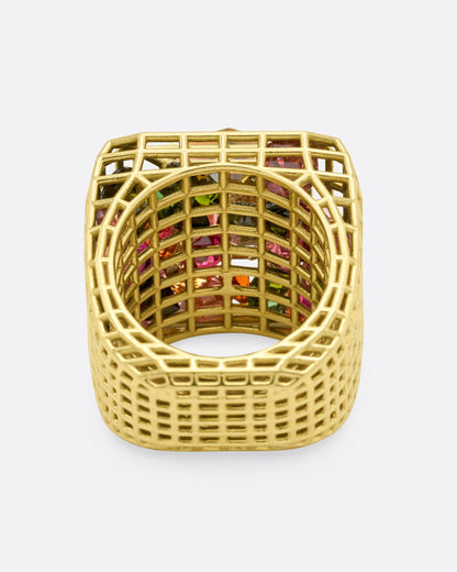 Green gold and bicolor tourmaline cage ring, inside view through the band showing pink and green stones caught in the cage