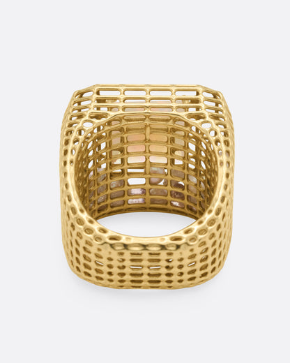 Yellow gold and opal cage ring, inside view through the band showing the pearls caught in the cage