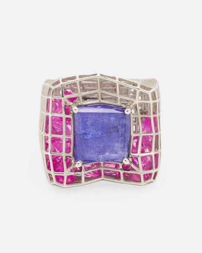 Sterling silver and blue quartz cage ring, top view of the blue quartz framed by a grid of pink stones
